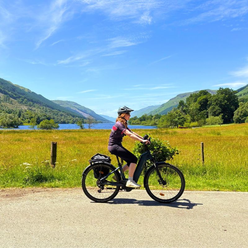 Female cyclist riding in Scotland on a leisure cycling tour